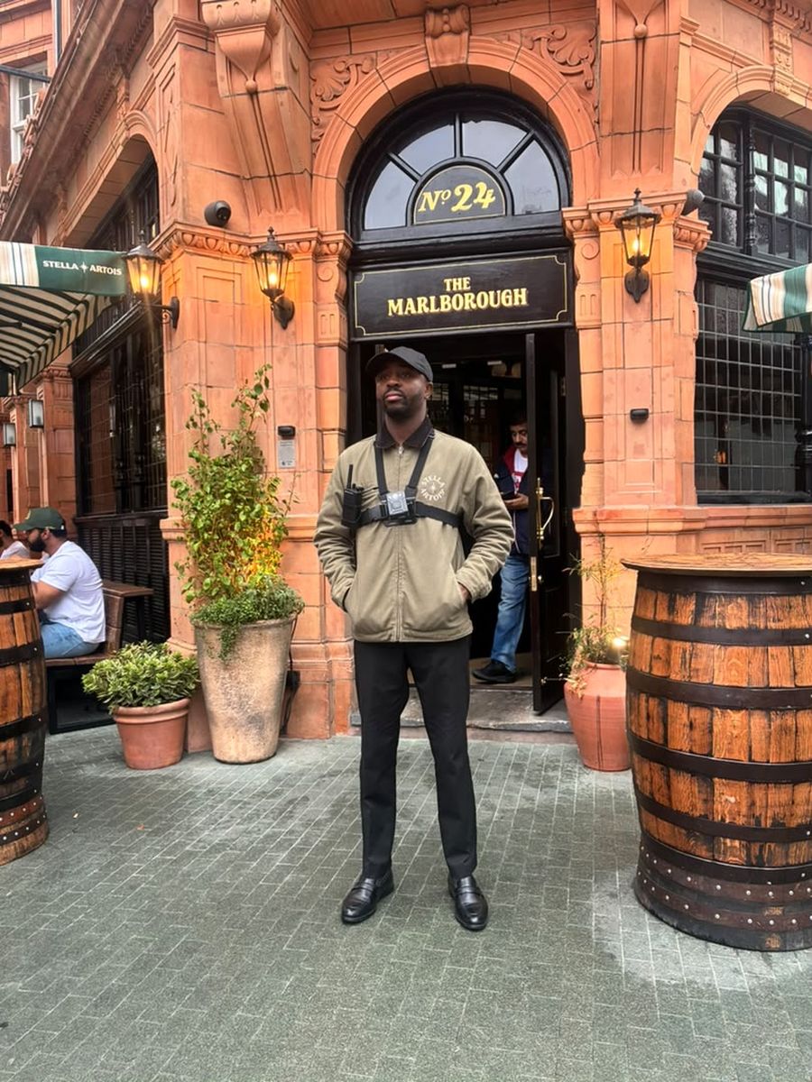 Mustapha Fadeyi, founder of Titans by Fàdé, on door supervision duty outside a London pub
